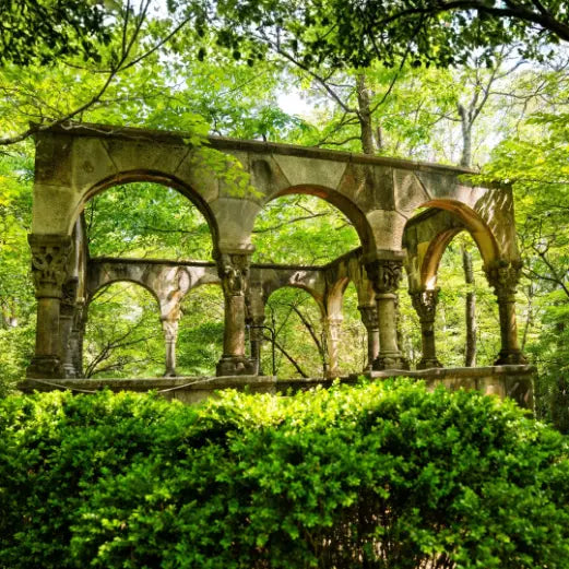 Historic stone cloister with arched columns in the gardens at MacCallum More Museum & Gardens in Chase City VA