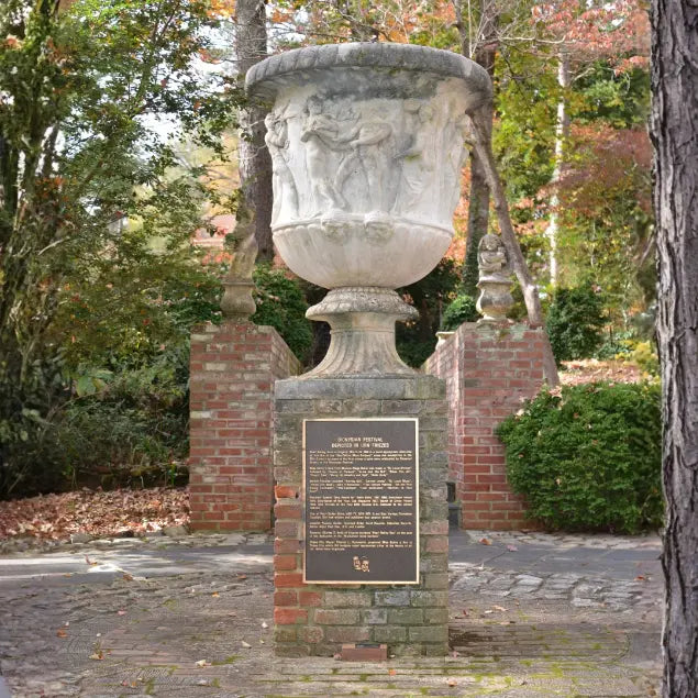 Dionysian Urn stone sculpture displayed in the gardens at MacCallum More Museum & Gardens in Chase City VA