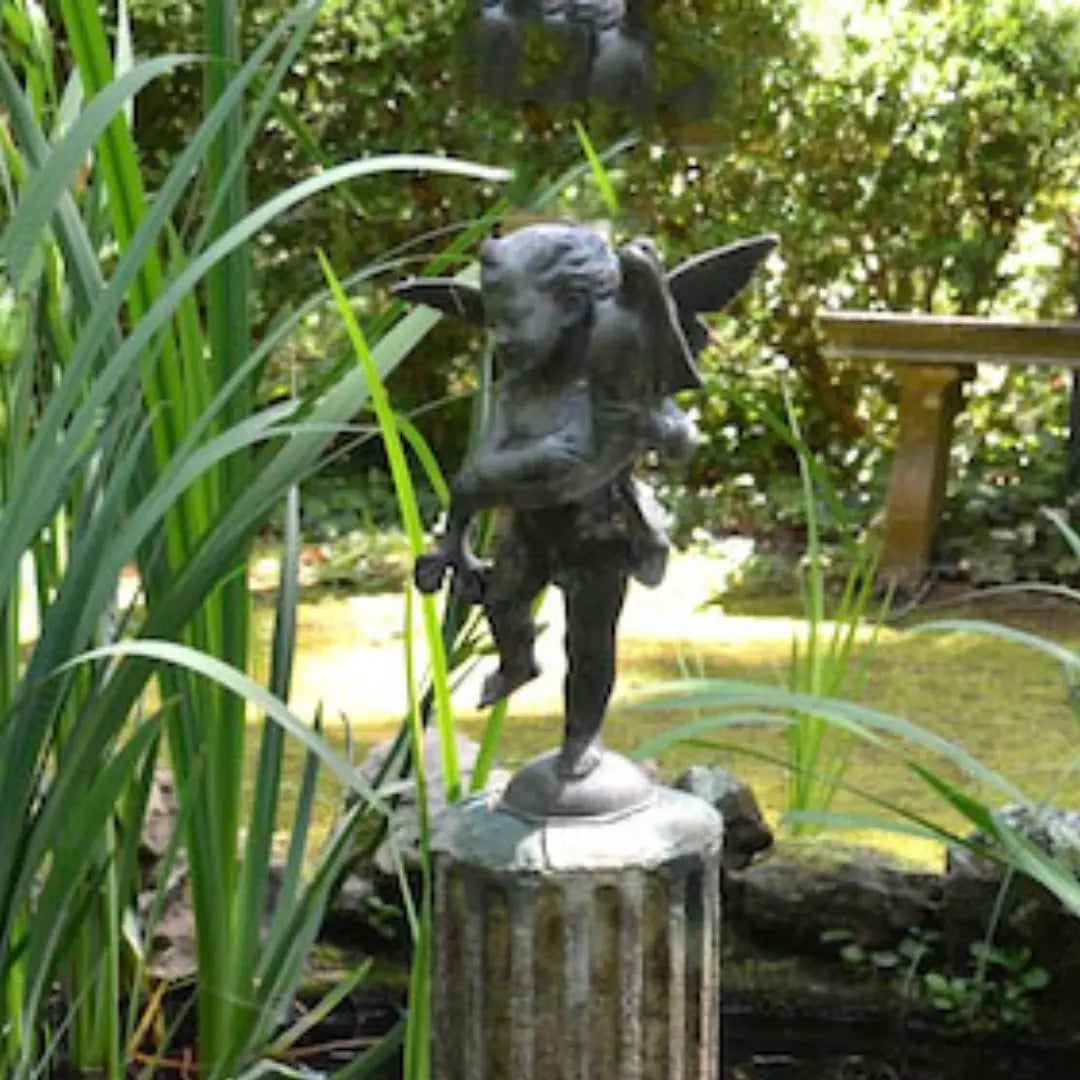 Putto with Dolphin statue displayed inside the museum at MacCallum More Museum & Gardens in Chase City VA